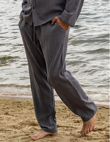 Men's linen trousers are loose in the pockets. BALI