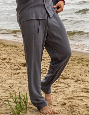 Men's linen trousers are loose in the pockets. BALI