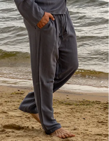 Men's linen trousers are loose in the pockets. BALI